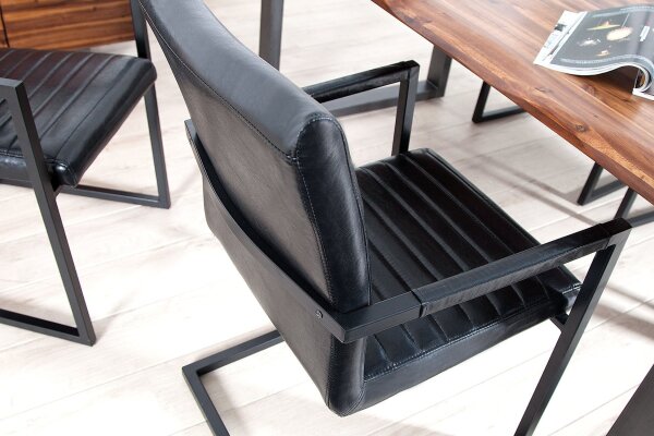 Chaise à bascule noir similicuir acier inoxydable avec accoudoirs